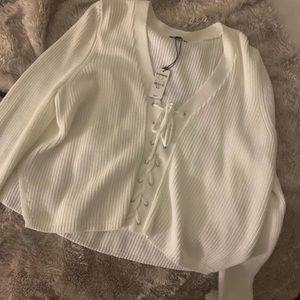 White sweater never worn, lace up detail in front